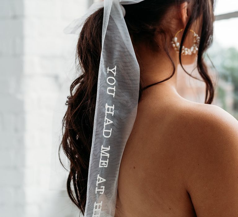 Tulle bow wedding hair accessory with embroiled You Had Me At Hello quote 