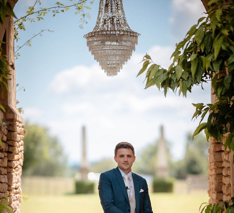 Groom wears Paul Smith suit on his wedding day whilst stood outdoors