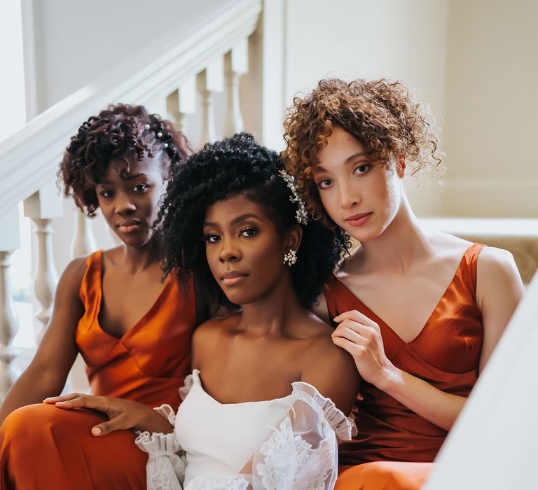 Bride and bridesmaids with natural wedding makeup and hairstyles for afro and curly haired people