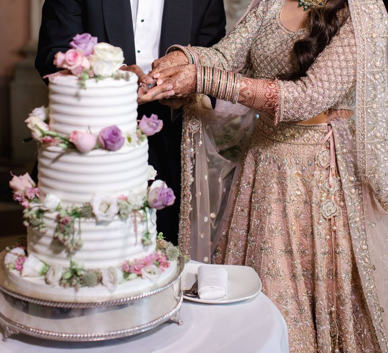 Bride & groom cut their wedding day on their wedding day