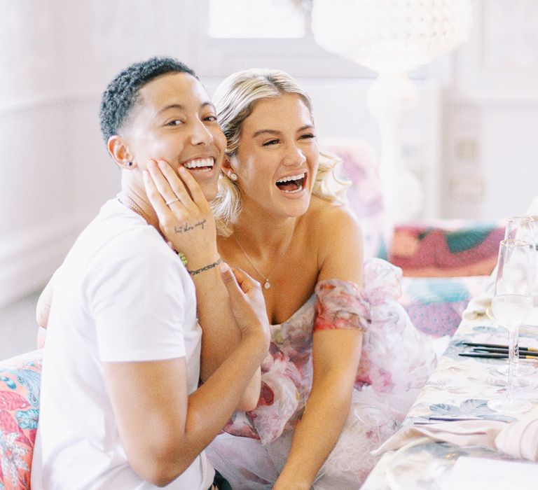 LGBTQI+ couple at floral wedding reception at Barnett Hill Hotel 