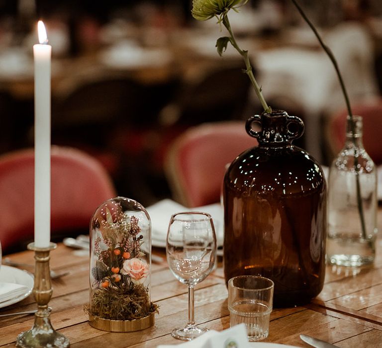 Rustic tablescape on wooden table complete with wildflowers in jug 