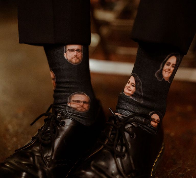 Groom wears vintage Dr Martens and socks with faces of his bride and self on 