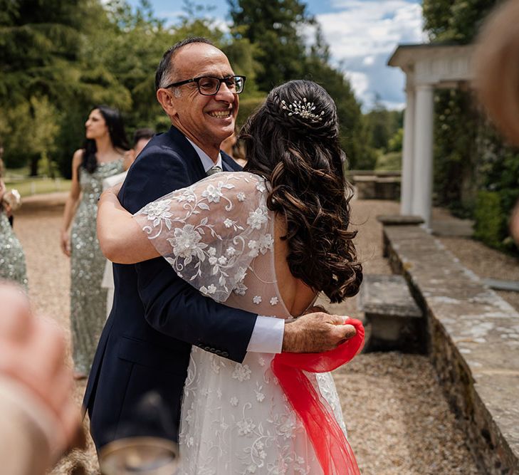 Bride & her father during the Greek wedding blessing outdoors at Northbrook Park 