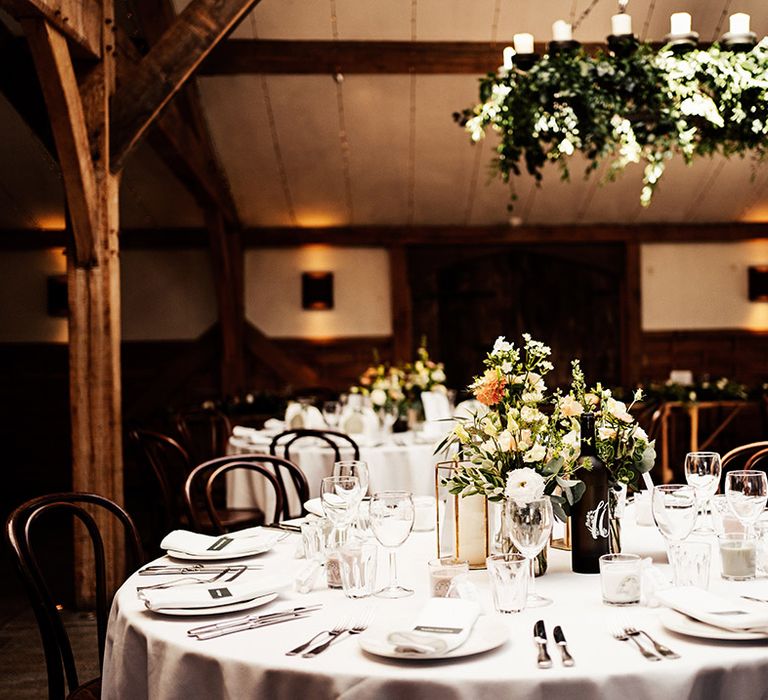 Cripps Barn wedding table setting decor with white crockery and linens