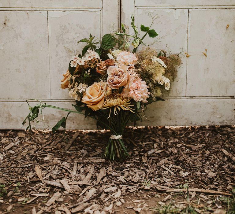 Pale dusty pink and rust rose bouquet for rustic wedding at Nancarrow Farm 