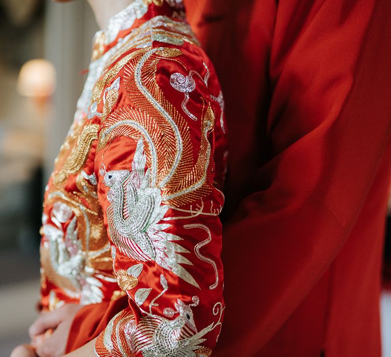 Bride wears intricately embroidered Chinese wedding dress 