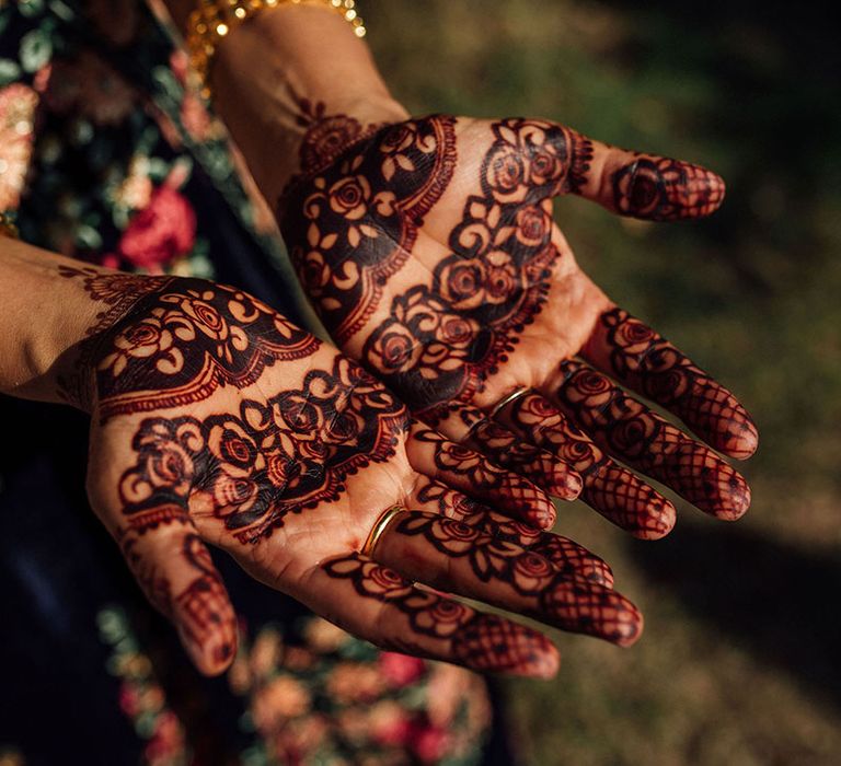 Intricate bridal henna with rose design 