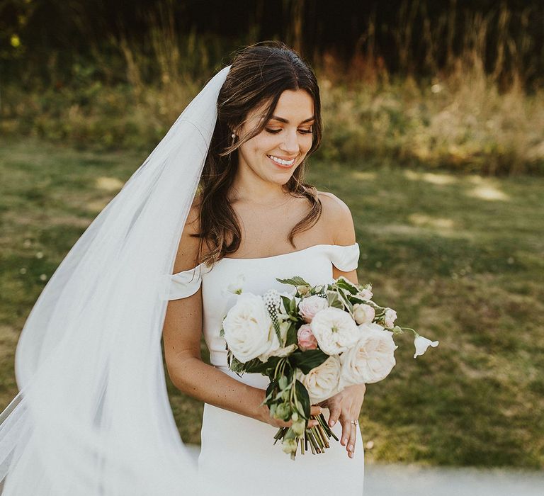  Bride in off the shoulder simple gown with veil 