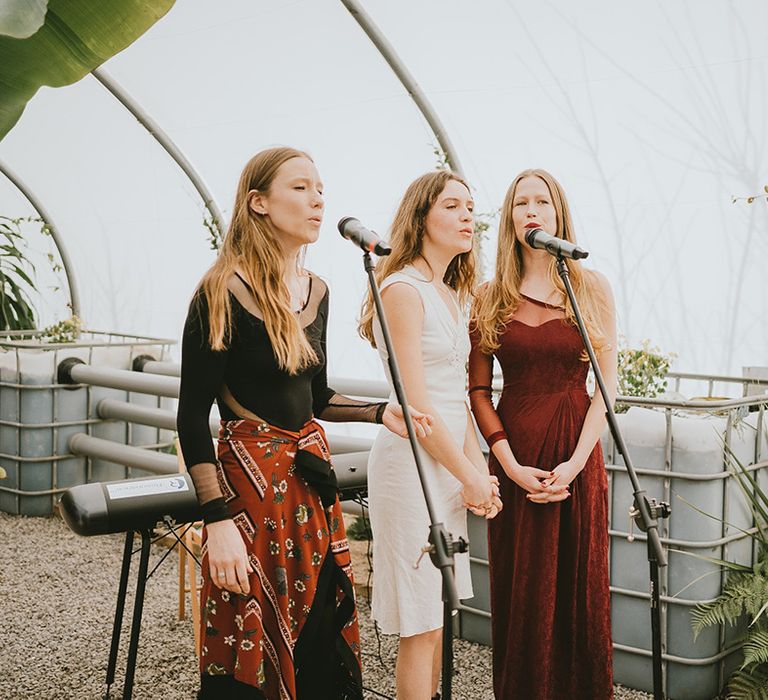 Wedding singers performing at the polytunnel wedding ceremony 