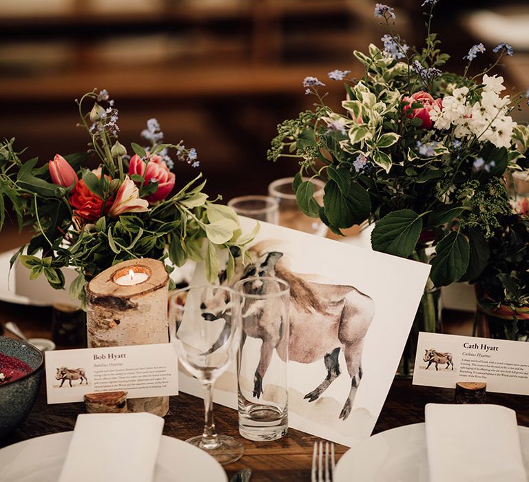 Animal theme wedding table name signs with matching place names 