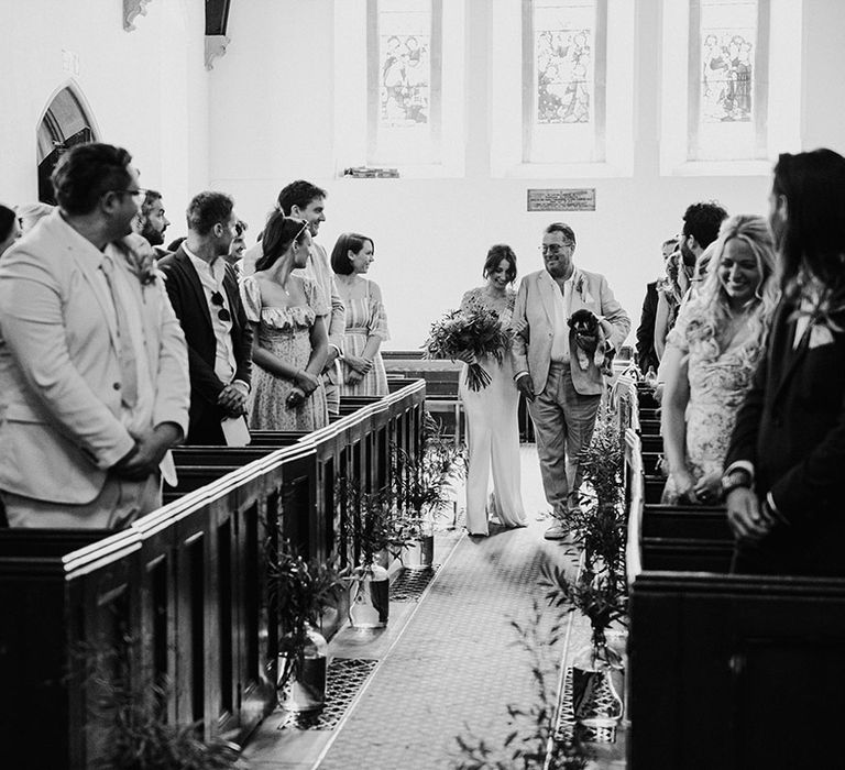 Special moment for the bride and father of the bride as they walk down the aisle 