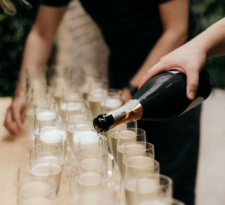 Glasses of champagne for wedding guests at city wedding 