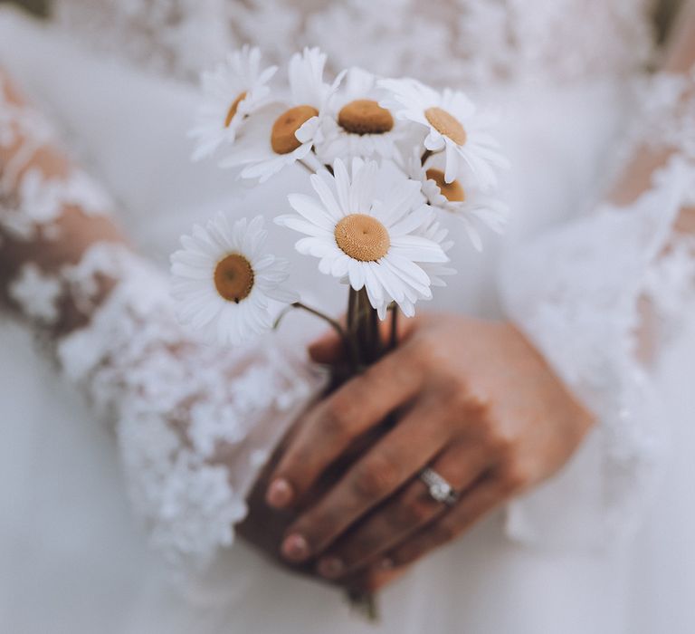 Bride holding white flower simple wedding bouquet for rustic wedding 