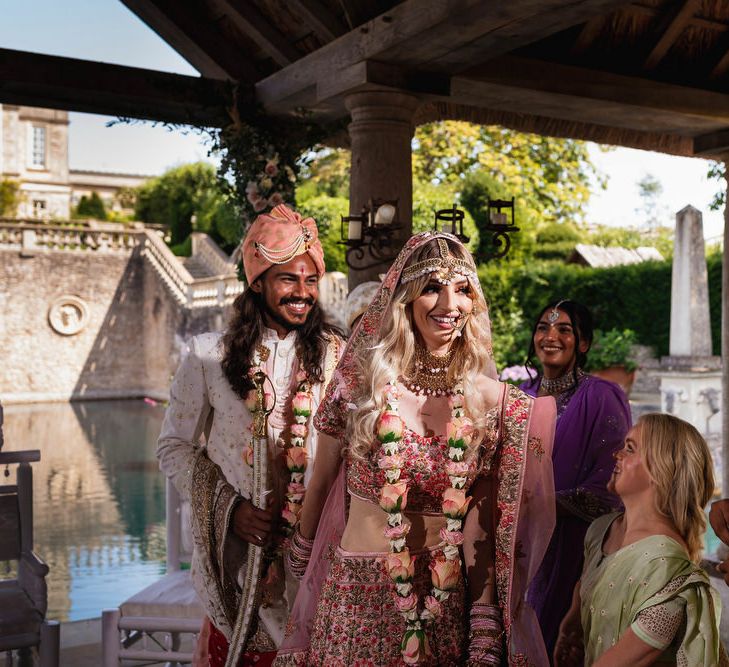 Bride in pink pink Indian wedding dress at The Lost Orangey Hindu ceremony 