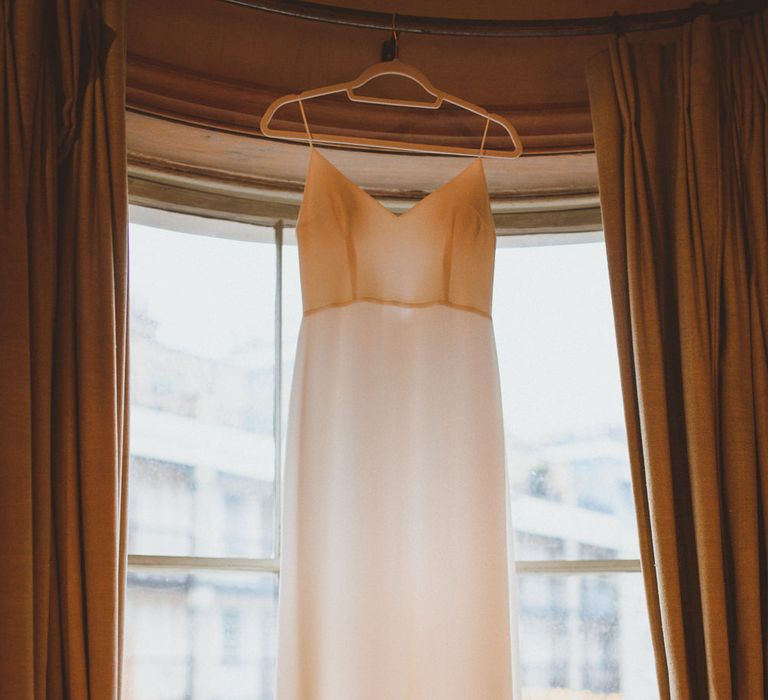 Wedding dress hanging before Chelsea London wedding 