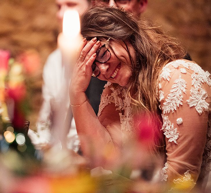 Bride enjoys wedding speeches