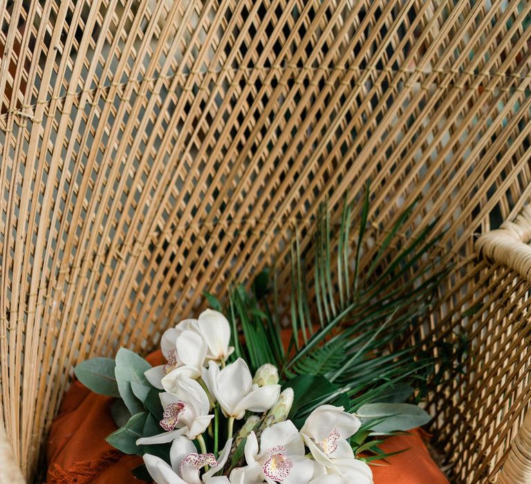 Jungle themed bouquet on rattan throne at Urban Jungle Suffolk