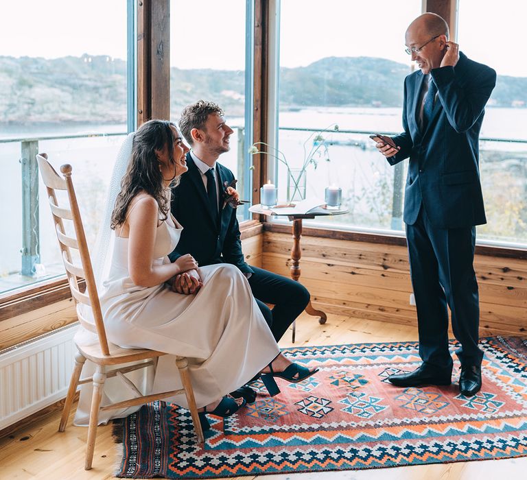 The bride's father reading aloud at the ceremony