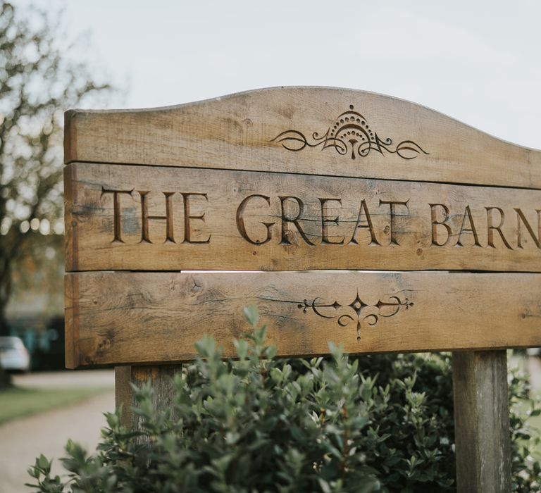 Wooden signage outside wedding venue