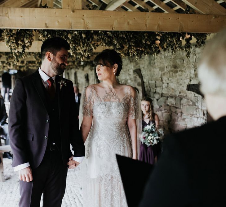 Wedding ceremony for a bride with homemade wedding bouquet and wedding dress