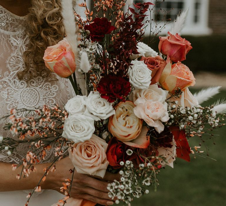 White, red and pink rose bouquet with wild grass details