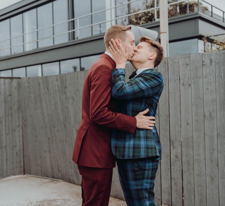 Grooms kiss after first-look moment on the morning of their wedding day | Kim Williams Weddings