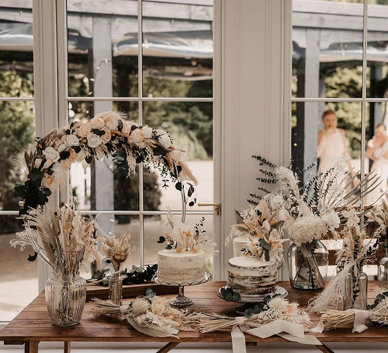 Dried floral arrangements on wooden table