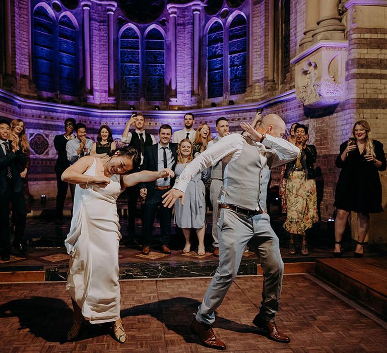 Bride & groom dance on their wedding day during reception 