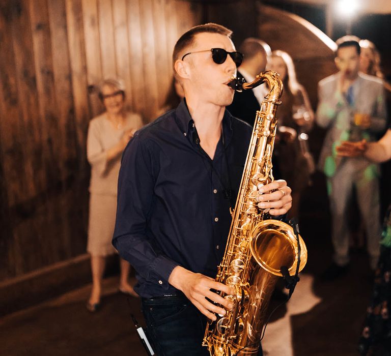 Wedding entertainment includes a saxophonist who played during the wedding reception