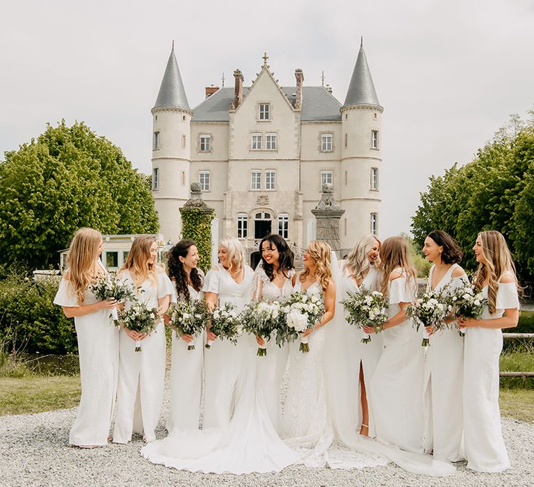 Brides in lace wedding dresses with trains and bridesmaids in sparkly front slit dresses 