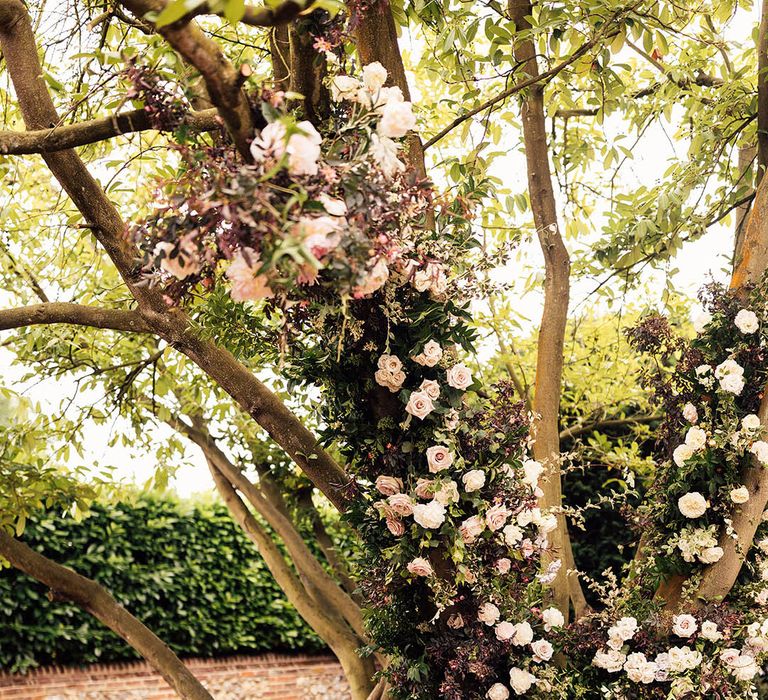 White wedding flowers decorating the outdoor civil wedding ceremony 