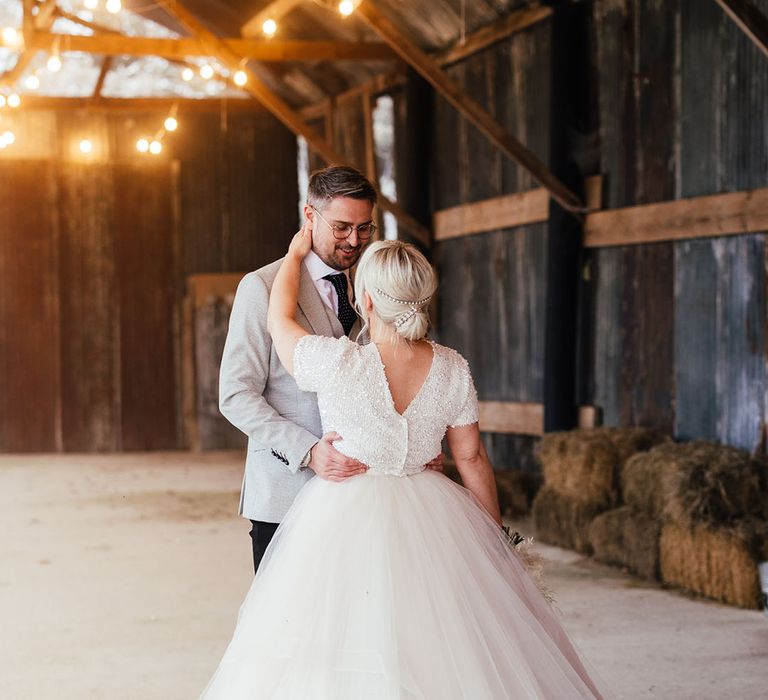 Bride in princess style bridal separates spinning her skirt around at the grounds of Silchester Farm wedding venue