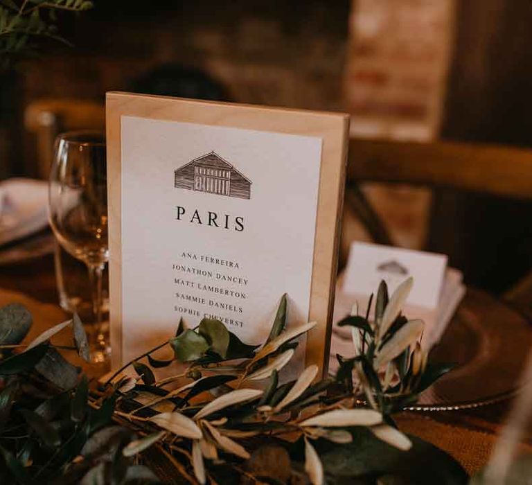 Minimalistic wedding table sign with pencil drawing of High Billinghurst Farm wedding venue 