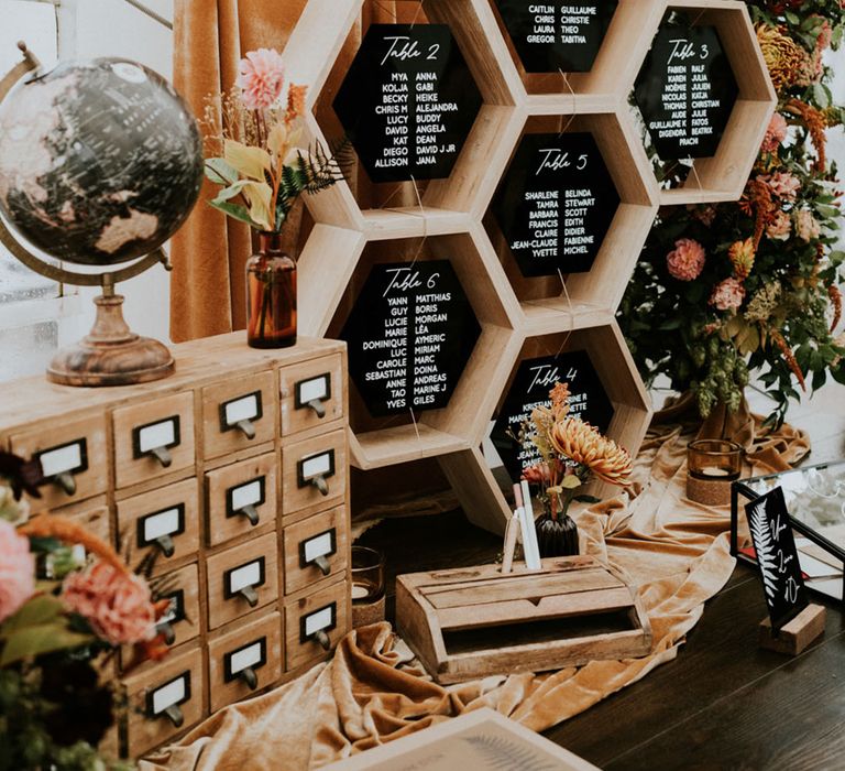 wood acrylic and wildflower wedding decor with hexagonal table plan and guest book table 