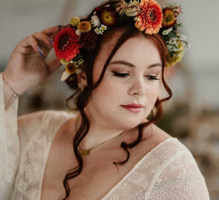 Bride in rustic boho bridal flower crown and v neck boho long sleeve wedding dress at The Barn at Avington