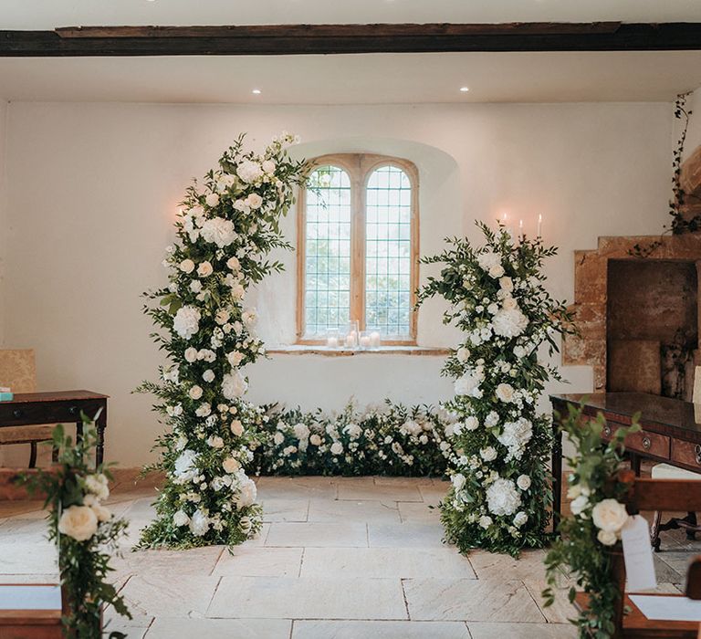 White rose and delphinium wedding flower column altar decorations 