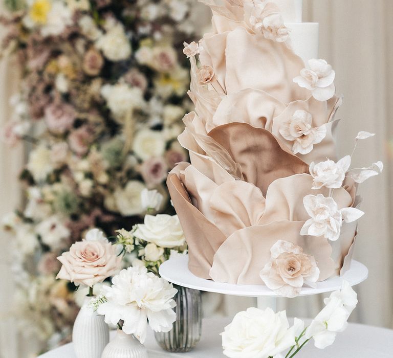 Neutral three tier pink and white wedding cake 