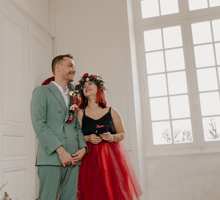 Maid of honour with groom in green double breasted wedding suit at same sex elopement 