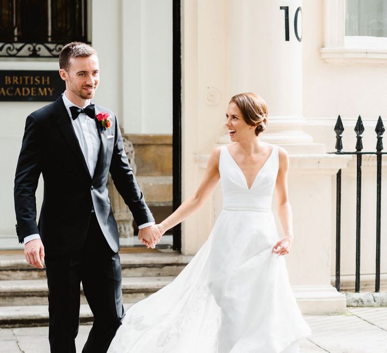 Bride in Stephanie Allin wedding dress and groom in tuxedo at black tie wedding