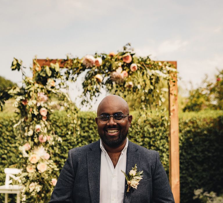 Groom at the altar for outdoor garden wedding 