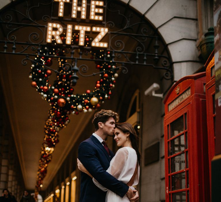 Bride and groom embracing outside the Ritz at Micro wedding 