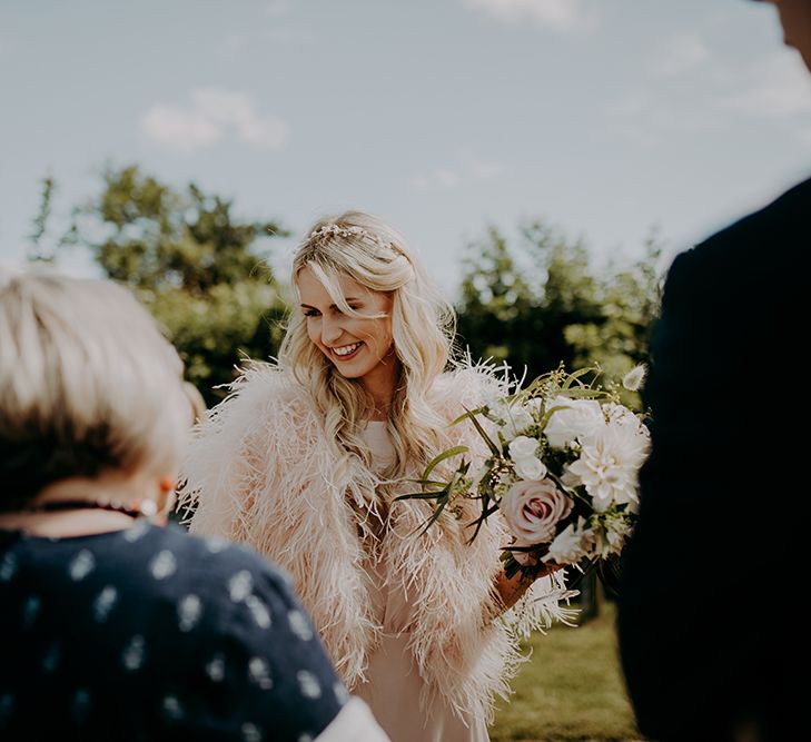 Bridesmaid in feather coverup 