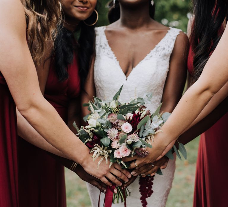 Burgundy bridesmaid dresses and wedding bouquet 