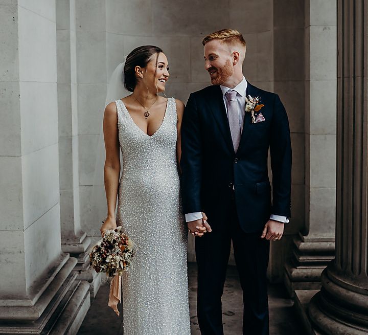 Old Marylebone Town Hall wedding with pregnant bride in sequin wedding dress