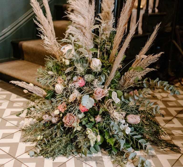 Wedding flower arrangements with pampas grass, eucalyptus and pink roses 