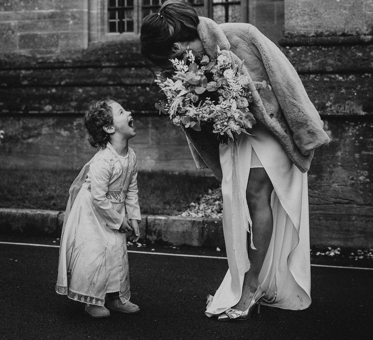 Bride with little girl in black & white image