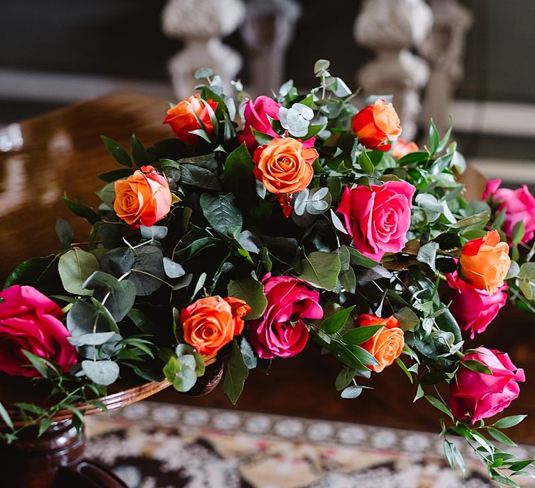 bride pink and coral wedding rose floral arrangement 