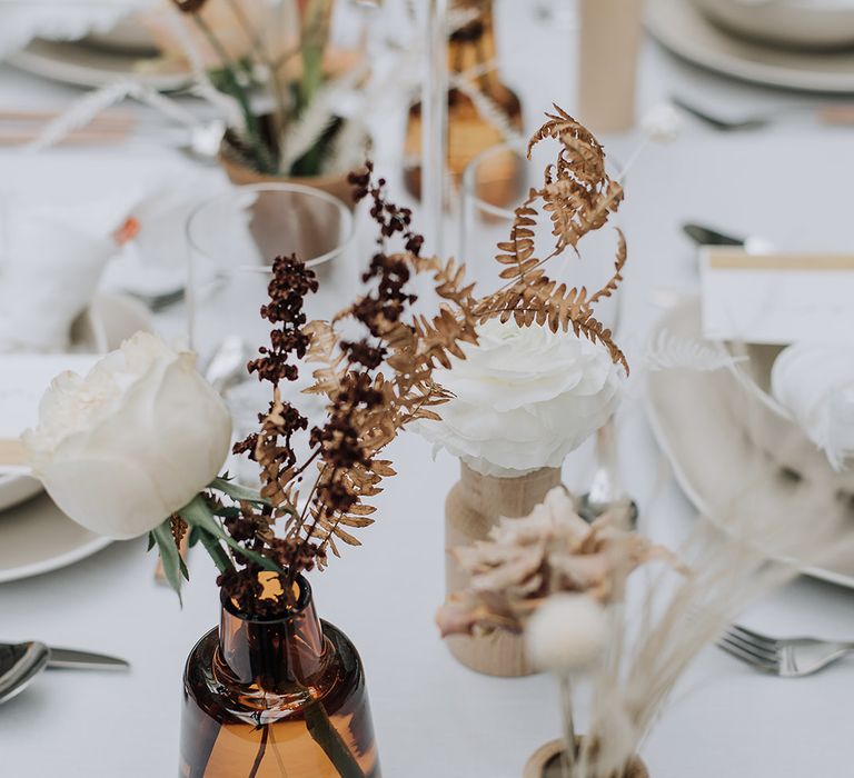 Dried wildflowers with fresh white florals for luxe all white wedding tablescape