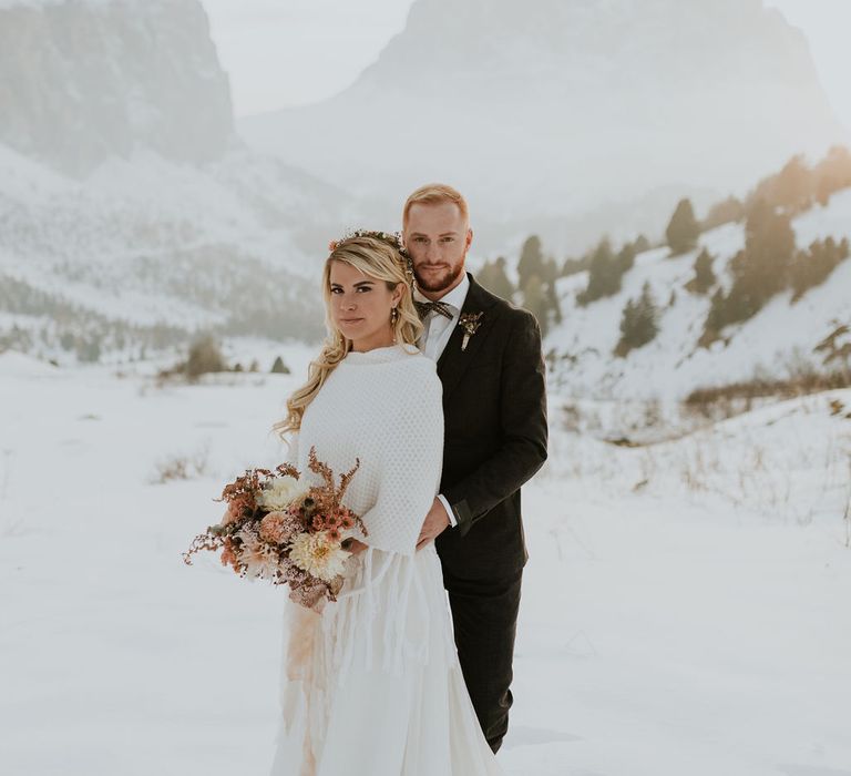 Bride and groom portrait at snowy Dolomites elopement 